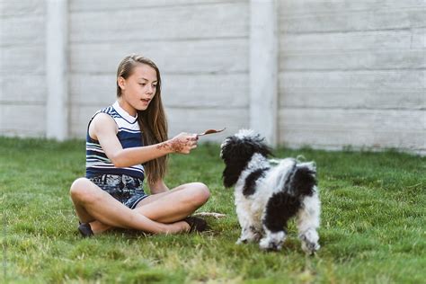 teen sucks dog|Beautiful Young Girl Playing with her Dog .